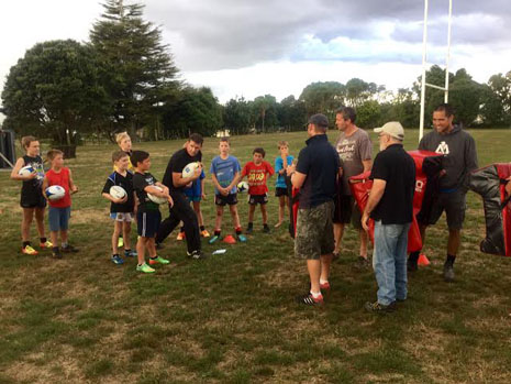 John and the kids demonstrating a skill while Onewhero coaches watch and learn.