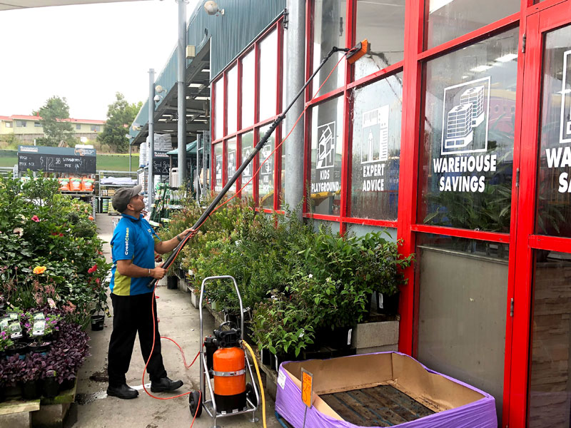 CrestClean business owner Tarun Kumar using the Pure Water Window system at Bunnings Warehouse.