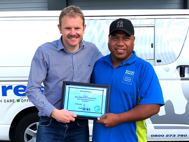 Bura Takinoa receives his long service award from Sam Lewis, General Manager CrestClean Franchise Services.
