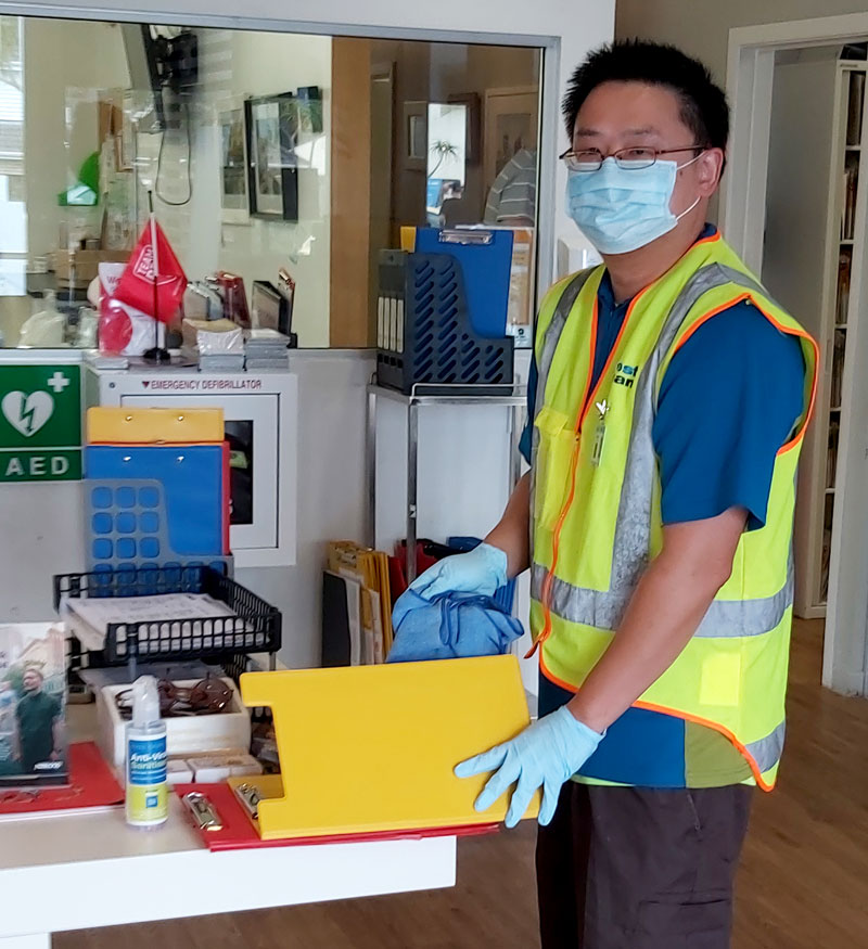 Wayne Ng carrying out a sanitising clean for New Zealand Blood Service in Auckland.