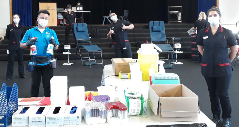 Zaldy Verallo with New Zealand Blood Service staff during a mobile collection clinic at Rangiora High School.