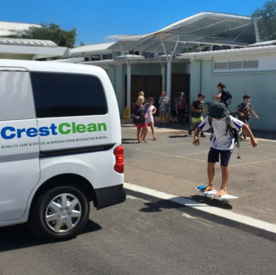 School and Childcare Cleaning Services - CrestClean van by school kids playing