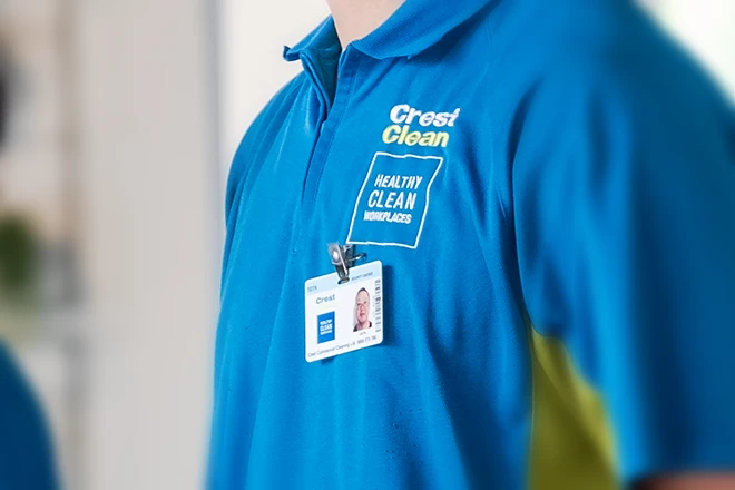 Zoomed view of security vetted badge on CrestClean polo