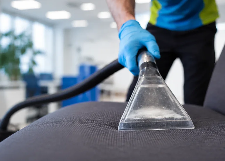Upholstery Cleaning Services - Cleaning chair cushion with specialist equipment